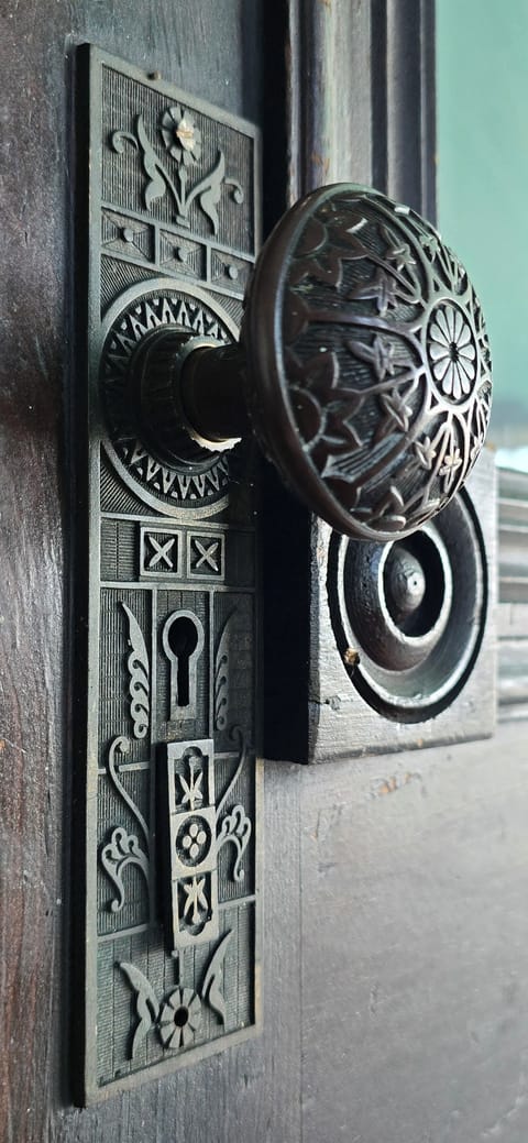 A picture on the front door hardware detail.