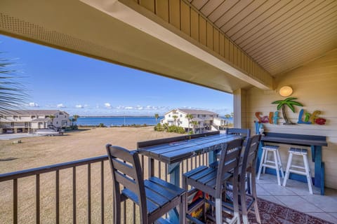 Relax on the balcony with stunning bay views and coastal decor.