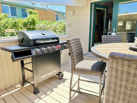 Deck outside the kitchen with dining table