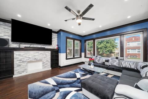 Living Room with 85 Inch Samsung 4K TV, Dolby Atmos Surround Sound, Sofa