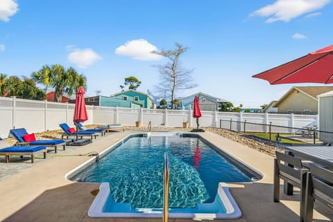 HUGE saltwater private {heated} pool with lounge chairs, dining and umbrellas to ensure everyone is comfortable