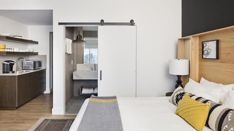 Settle in with handy kitchenette comforts right beside the bed.