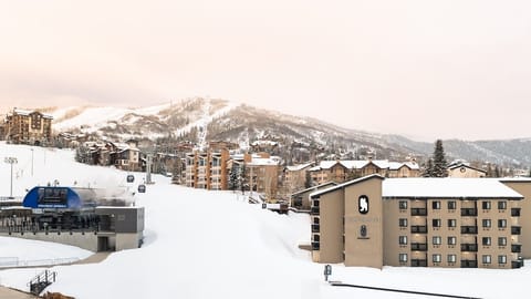 Wake up steps from the slopes with snowy mountain views.