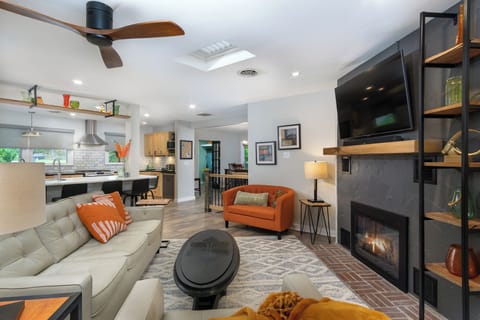 Living room with gas logs fireplace & 55" Smart TV (cable & YouTube TV available).