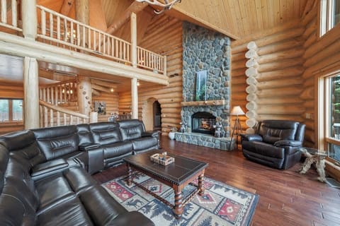 Curl up next to the fireplace while taking in the gorgeous views