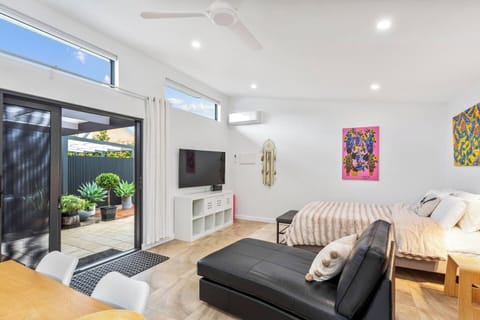 The northeast-facing living area, enhanced by a rake ceiling, feels bright and spacious.