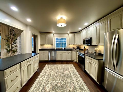 Spacious kitchen stocked with all the essentials.
