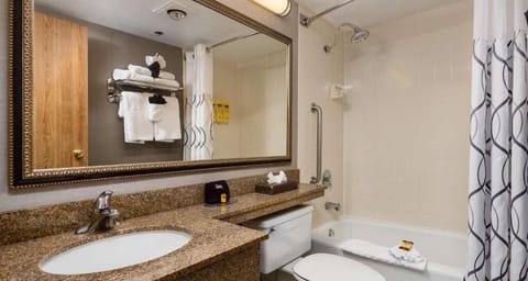 Refresh easily with a roomy tub-shower and bright vanity.