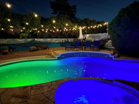 Amazing colors at night accent the pool and spa!