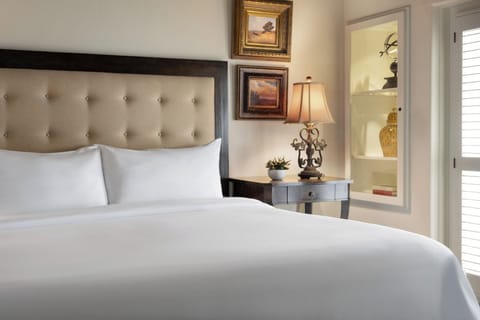 Drift off surrounded by plush pillows, soft light, and calm.