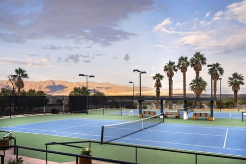 Play a lively match with sweeping mountain sunset views.