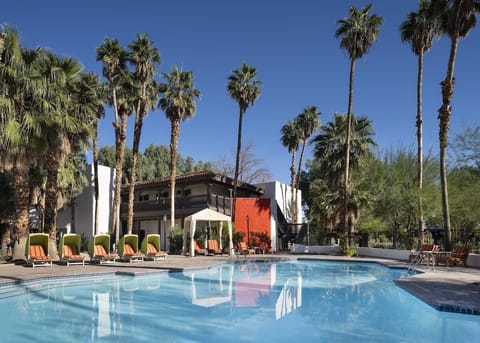 Stretch out by the expansive pool with plentiful sun loungers.