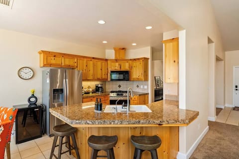 Serenity Vista Retreat includes a full kitchen with plenty of pantry space for groceries, wine cooler, waffle maker, toaster oven, and more!