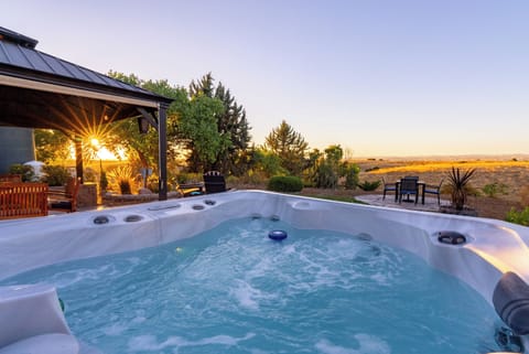 Jetted hot tub where you can enjoy the views of open space for miles.