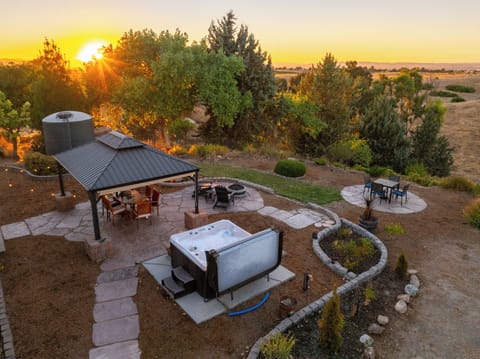 This backyard has it all... al Fresca dining, hot tub, cafe lights, and a gazebo for shade. The views are incredible!