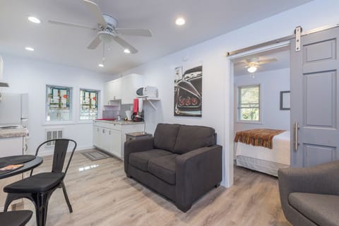 Unwind in the inviting living room, featuring comfortable seating and a warm ambiance, ideal for relaxation after a day of exploration.