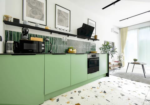 Green Delight: The vibrant green cabinets add a refreshing touch to your culinary space.