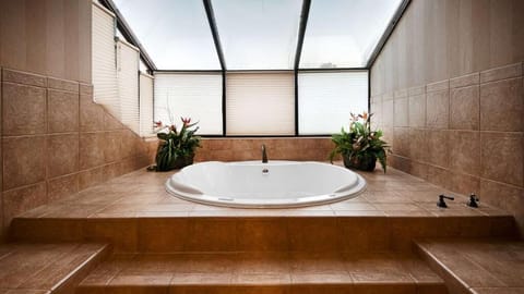 Slip into deep relaxation with a spacious jetted soak.