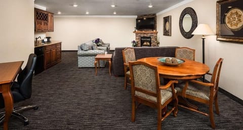 Unwind together in the spacious suite with cozy fireplace glow.