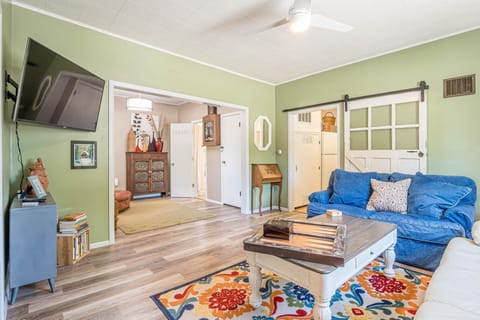 Bold colors and cozy vibes—this living space is as inviting as it is stylish!