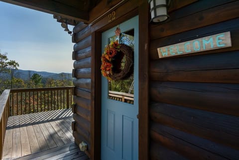 Welcome sign & peek of the mountain views that await you at the front door entrance.
