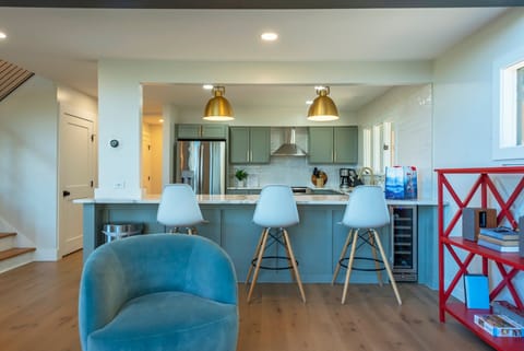 Island seating for 3 by the kitchen.