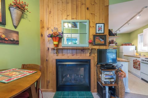 Living room with gas logs fireplace & TV (cable and DVD player).
