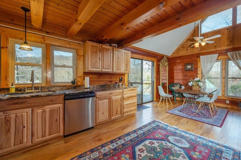 Kitchen with stainless appliances, dishwasher & standard drip coffeemaker.