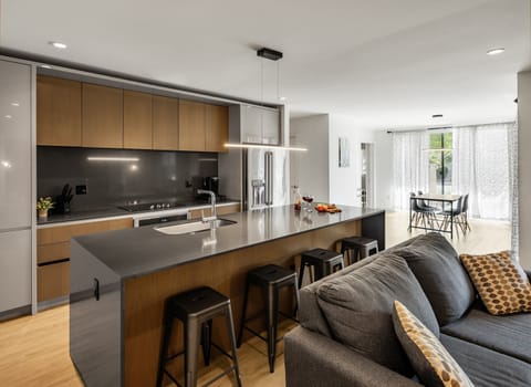 Fully equipped modern kitchen completely stocked with all culinary essentials and includes high-end Cafe stainless steel appliances.