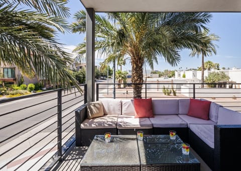 1st Floor: Private balcony off the living room offering outdoor furnishings for lounging.