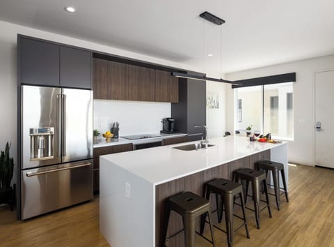 1st Floor: Fully equipped modern kitchen completely stocked with all culinary essentials and includes high-end Cafe stainless steel appliances.