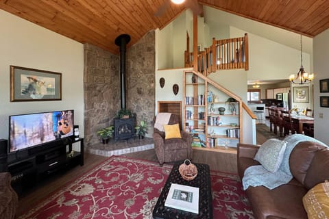 Wood burning fireplace, books galore and a smart tv in this comfy family room