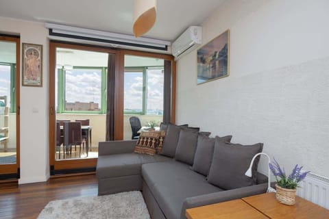 Relax in the stylish living room with a comfortable sofa and modern decor.