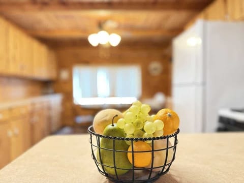 Fruit basket with view of the kitchen.