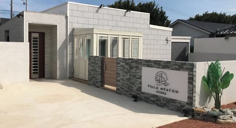 Exterior and parking space (white concrete area)