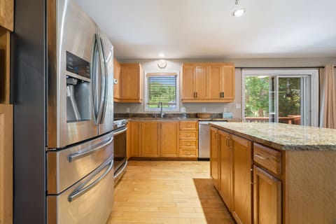 Fully equipped kitchen with updated appliances and 6-person dining table