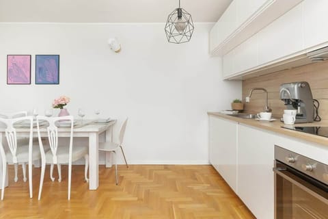 Kitchenette with oven and refrigerator. 