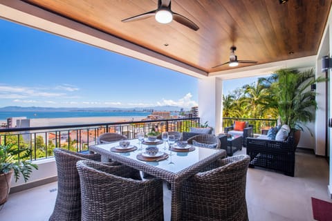 The oversized private balcony boasts a BBQ and dining table