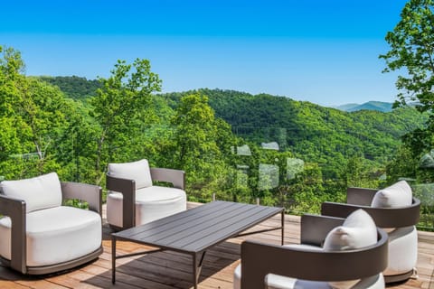 Private sky deck with panoramic mountain views, and elevated outdoor luxury.
