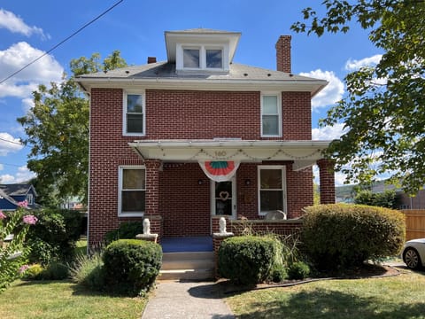 Elegant all brick colonial in the heart of Romney, featuring 4 beds, 2 baths.