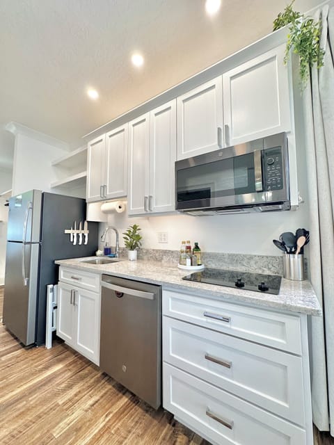 There are 2 full kitchens. 2 Microwaves,toasters, blenders,convection ovens, etc