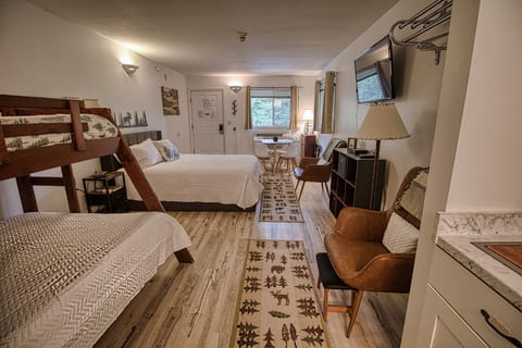 Room now has an updated TV and fireplace wall. 