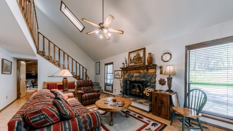 Entry opens into formal living room with wood burning fireplace.
