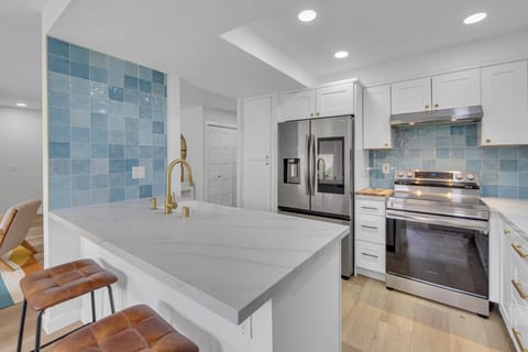 Fully-stocked kitchen with bar stool seating for 2