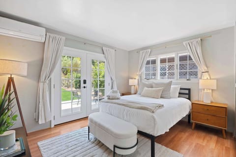 Bedroom (queen bed, AC, TV, French windows, backyard)