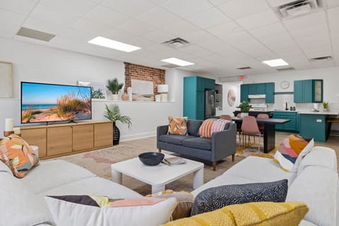 Wide-screen TV. Lush and cozy furniture. A cool, fully-equipped kitchen. Boom.