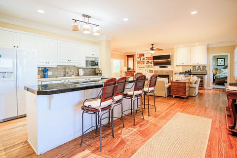 seating at the island counter top to visit with the chef 