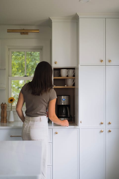 Open your conveniently place coffee cabinet and quickly prepare your coffee. 