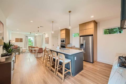 Bright, open-concept kitchen flows seamlessly into the dining area for effortless entertaining.