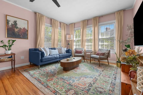 Sunlit living room seats 5 adults comfortably